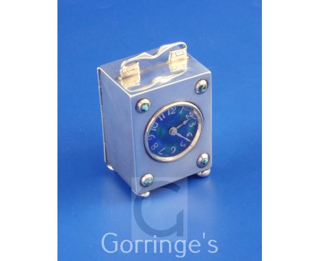 A George V Arts & Crafts Liberty & Co silver, enamel and cabochon turquoise set carriage timepiece, numbered 5308, of rectang