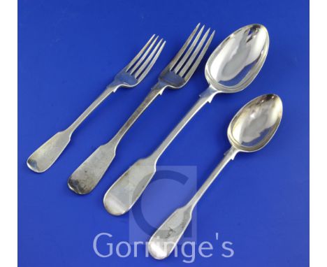 A Victorian matched part suite of silver fiddle pattern flatware, with engraved armorial, comprising eighty six items, differ