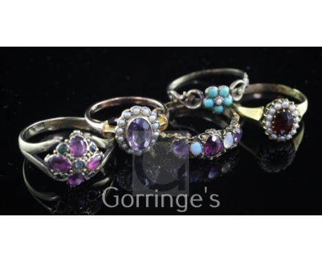 Five late 19th/early 20th century gold and gem set rings, including 15ct gold half hoop and 18ct gold garnet and seed pearl c