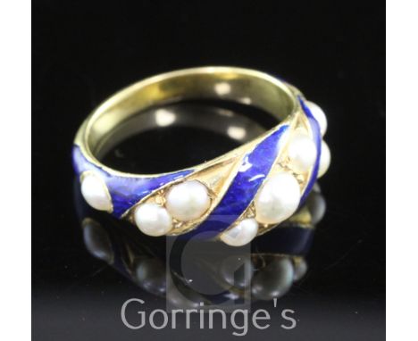 A 19th century gold, blue enamel and split pearl mourning ring, with spiral decoration and set with nine split pearls, the sh