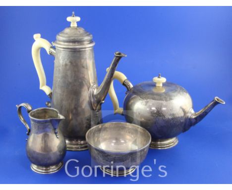 A George V 18th century style silver four piece tea and coffee service by Goldsmiths & Silversmiths Co Ltd, with engraved ban