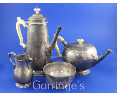 A George V 18th century style silver four piece tea and coffee service by Goldsmiths & Silversmiths Co Ltd, with engraved ban