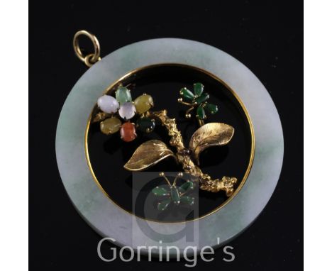 A 14ct gold, jade and cabochon gem set open disc pendant, with central foliate motif, 2.25in.