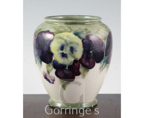 A William Moorcroft "Pansy" pattern ovoid vase, c.1918, with pale green to cream graduated ground, impressed marks 'Moorcroft