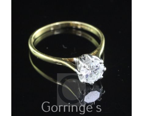 An 18ct gold and solitaire diamond ring, the round brilliant cut stone weighing approximately 0.70-0.75cts, size M.