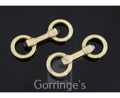 A pair of engine turned silver gilt and onyx double ring cufflinks, with onyx set terminals, 1.5in.