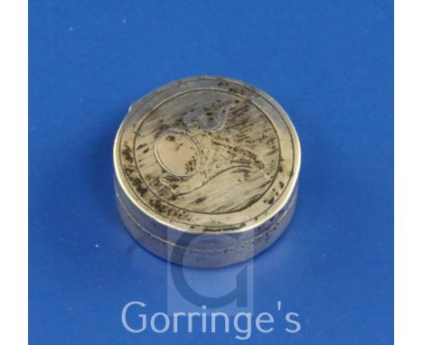 A George III silver circular vinaigrette, engraved with a cherub holding a mirror, and with a young boy playing the flute en 