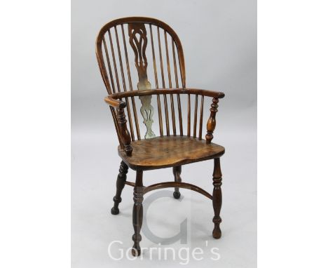 A 19th century elm, ash and yew wood comb back Windsor chair, H.3ft 6in.