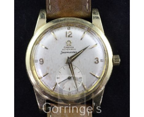 A gentleman's early 1950's 18ct gold Omega Seamaster automatic wrist watch, with baton and quarterly Arabic numerals and subs