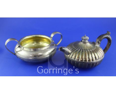 A George III silver bachelor's teapot, of squat circular form, with fluted decoration and a large two-handled sugar bowl, bot