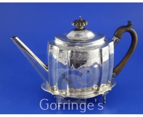 A George III silver teapot by Crispin Fuller and a similar stand by Edward Capper?, the teapot of shaped oval form, with ivor