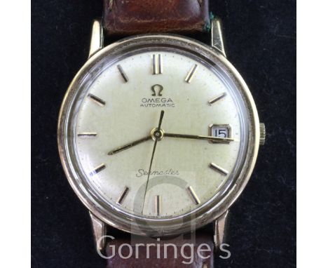 A gentleman's early 1970's 9ct gold Omega Automatic Seamaster wrist watch, with baton numerals and date aperture, movement c.