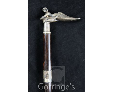 A 20th century English silver mounted rosewood sword stick, the handle modelled as a nude lady reclining within a slipper, 35