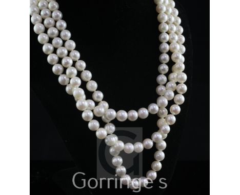 A modern triple strand cultured pearl necklace with 18ct gold, diamond and cultured pearl set oval clasp, 17.5in.