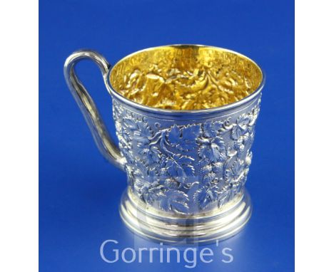A Victorian silver christening mug by John Samuel Hunt, of tapering cylindrical form, with rustic handle, engraved monogram a