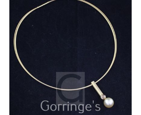 A modern 18ct gold, diamond and cultured pearl pendant necklace by Marion Autrum, the triple fine strand necklace with baton 