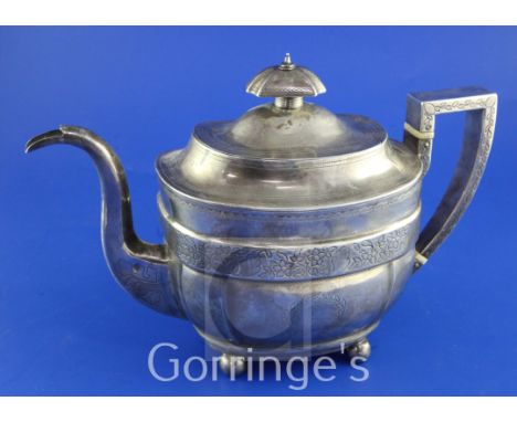 A George III silver teapot, of rounded rectangular form, with engraved floral band, on ball feet, Urquhart & Hart, London, 18