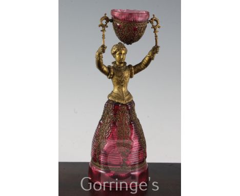 A German ruby glass and gilt metal figural marriage cup, probably Fritz Heckert, late 19th century, modelled as a lady in Ren