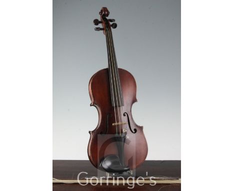 A violin, probably by F.W. Chanot, London 1900, after G. Guarneri the two piece back 14in. long, with label to interior inscr