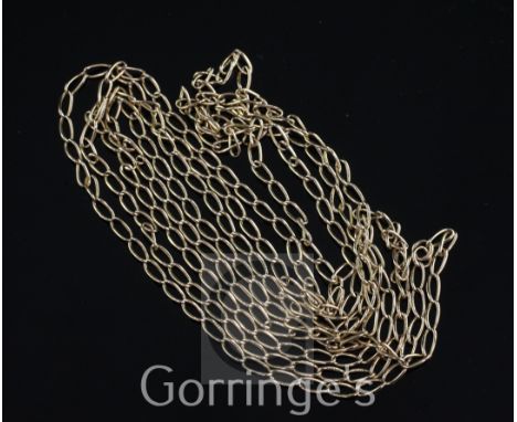 An early 20th century 15ct gold shaped oval link guard chain, 61.5in.