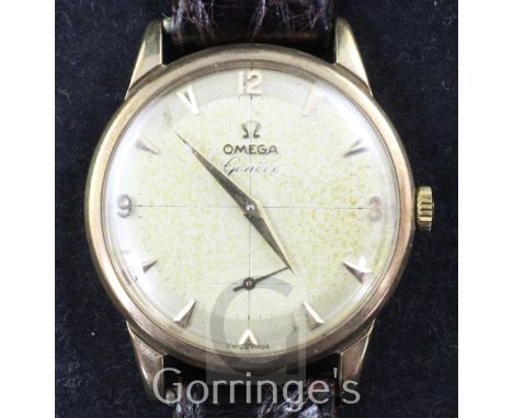 A gentleman's late 1950's 9ct gold Omega manual wind wrist watch, with arrow head and quarterly Arabic numerals and subsidiar