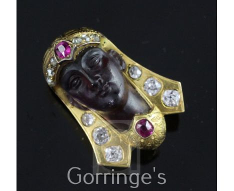 A late 19th/early 20th century gold, ruby, diamond and amethyst glass? clip brooch, modelled as the head of a Pharaoh, set wi