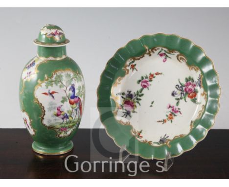 A Worcester green ground polychrome ovoid tea caddy and cover and a similar scalloped dish, c.1780, the tea caddy painted wit