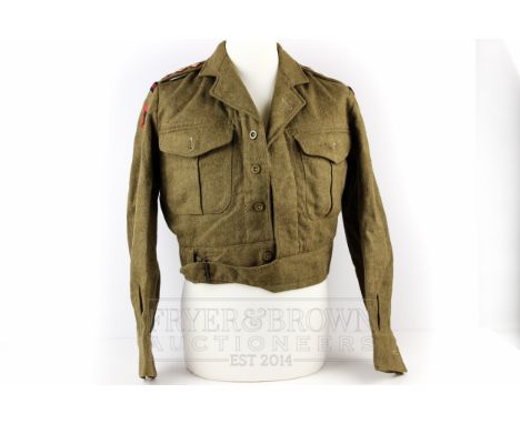 A British Army Captain's Royal Artillery battledress blouse jacket, 1949 pattern, size 11, three pips to epaulettes, Royal Ar
