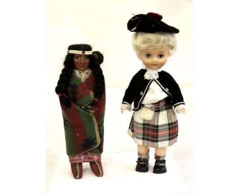 A vintage Native American Skookum doll, a woman with long plaits and headband with baby wrapped onto her shoulder, 18.5cm; to