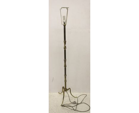 A vintage brass and onyx standard lamp base, on tripod base, fitted for electricity, 133cm high