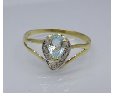 A 9ct gold, diamond and blue stone ring, 1g, N