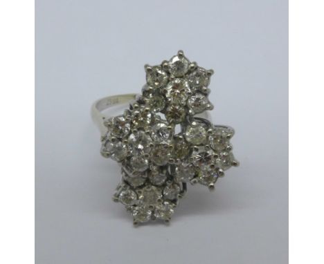 An 18ct white gold diamond, four cluster ring, twenty-eight round brilliant cut stones, colour I/J, SI1/SI2, 2.25ct weight, 6