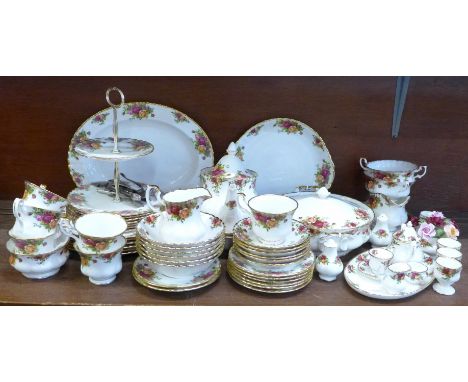 A suite of Royal Albert Old Country Roses china, comprising dinner, tea and side plates, cake stand, cereal bowls, cups, sauc