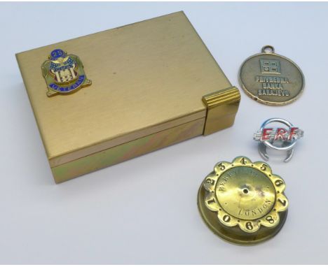 A Volupte lipstick/compact, a whist marker, ERF badge and a medallion