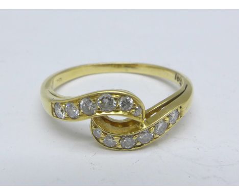 An 18ct gold and diamond crossover ring, 3.2g, Q