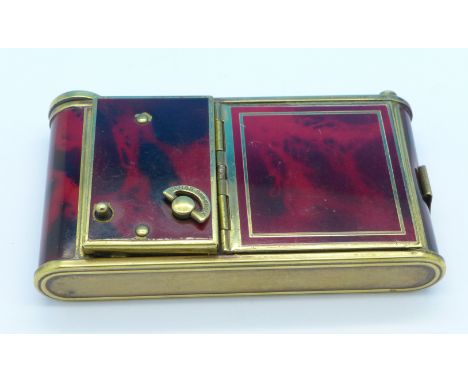 A musical compact case in the form of a camera
