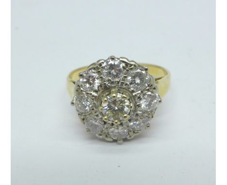 An 18ct gold and nine stone diamond cluster ring, over one carat diamond weight, weight 4.1g, L