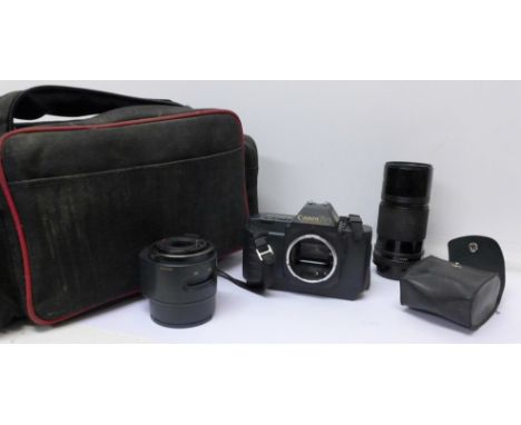 A Canon T80 film camera, two lenses, flash and bag