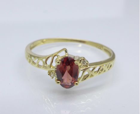 A 9ct gold, garnet and diamond ring, 0.9g, O