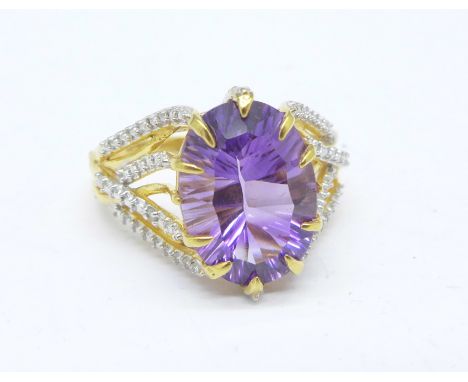 A silver gilt and amethyst ring with diamond accents, S