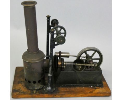 A stationary hot air engine by G. C. &amp; Co. N., mounted on a wooden plinth measuring 12 cm x 24 cm.  