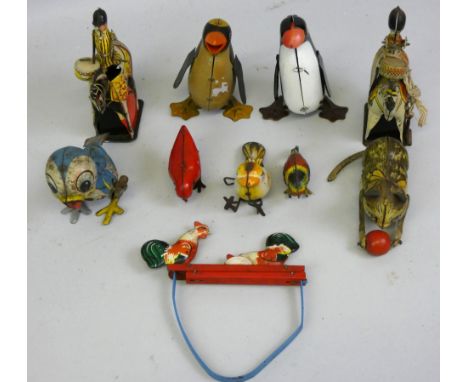 A collection of ten early tinplate toys including a British Wells Brimtoy clockwork drummer, numbered 23710, a similar Britis