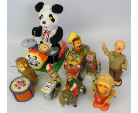 A collection of seven early tinplate toys including a British made lithograph 'Crazy Cowboy' wind-up toy car, a Japanese wind