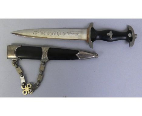 A reproduction SS dagger, with rune and skull hanger, 21.5 cm blade and 38 cm overall in scabbard.  