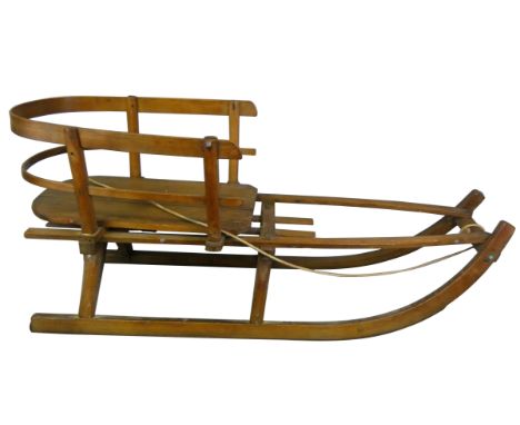 A vintage wooden sledge, total length 120 cm.  