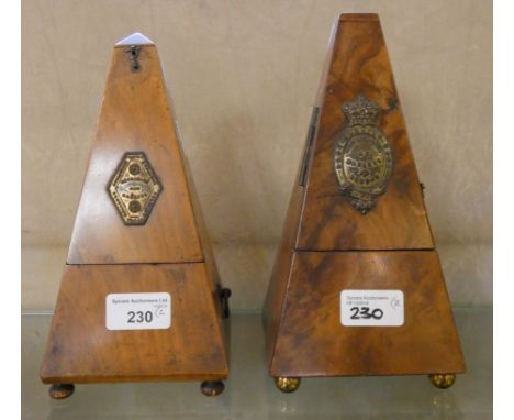 A Victorian walnut cased metronome, London made, together with a similar mahogany cased metronome(2)