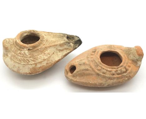 Two replica Roman terracotta oil lamps. P&amp;P Group 1 (£14+VAT for the first lot and £1+VAT for subsequent lots) 