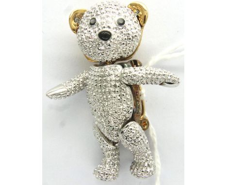 Yellow and white metal articulated stone set teddy bear brooch, H: 40 mm. P&amp;P Group 1 (£14+VAT for the first lot and £1+V