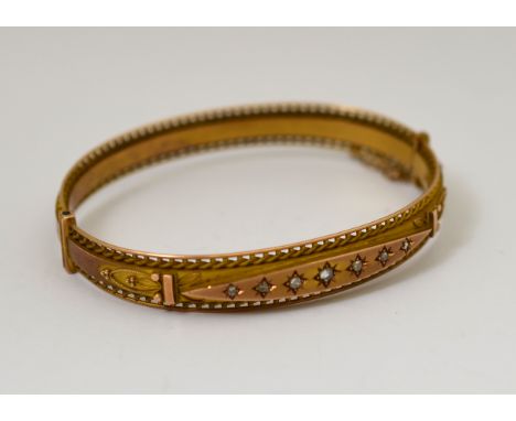 A 9ct rose gold hinged bangle set with rose-cut diamonds, H/M Chester 1912 with contemporary bangle box