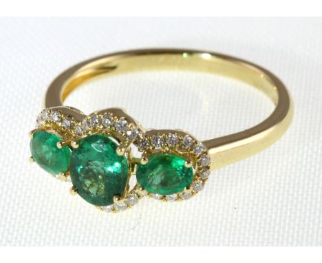 An 18ct H/M emerald & diamond three stone cluster ring, approx emerald weight 1.00ct, size N/O